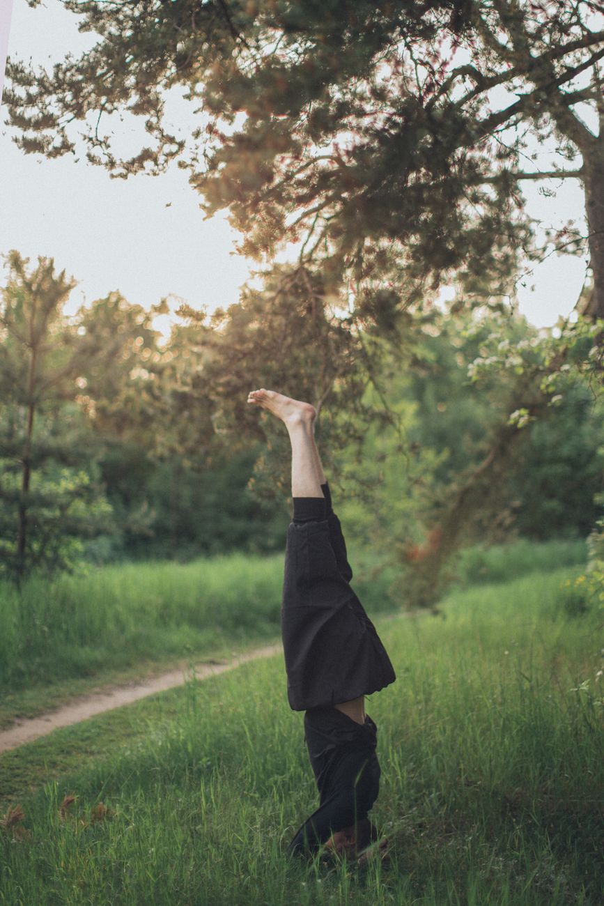 a person doing headstand