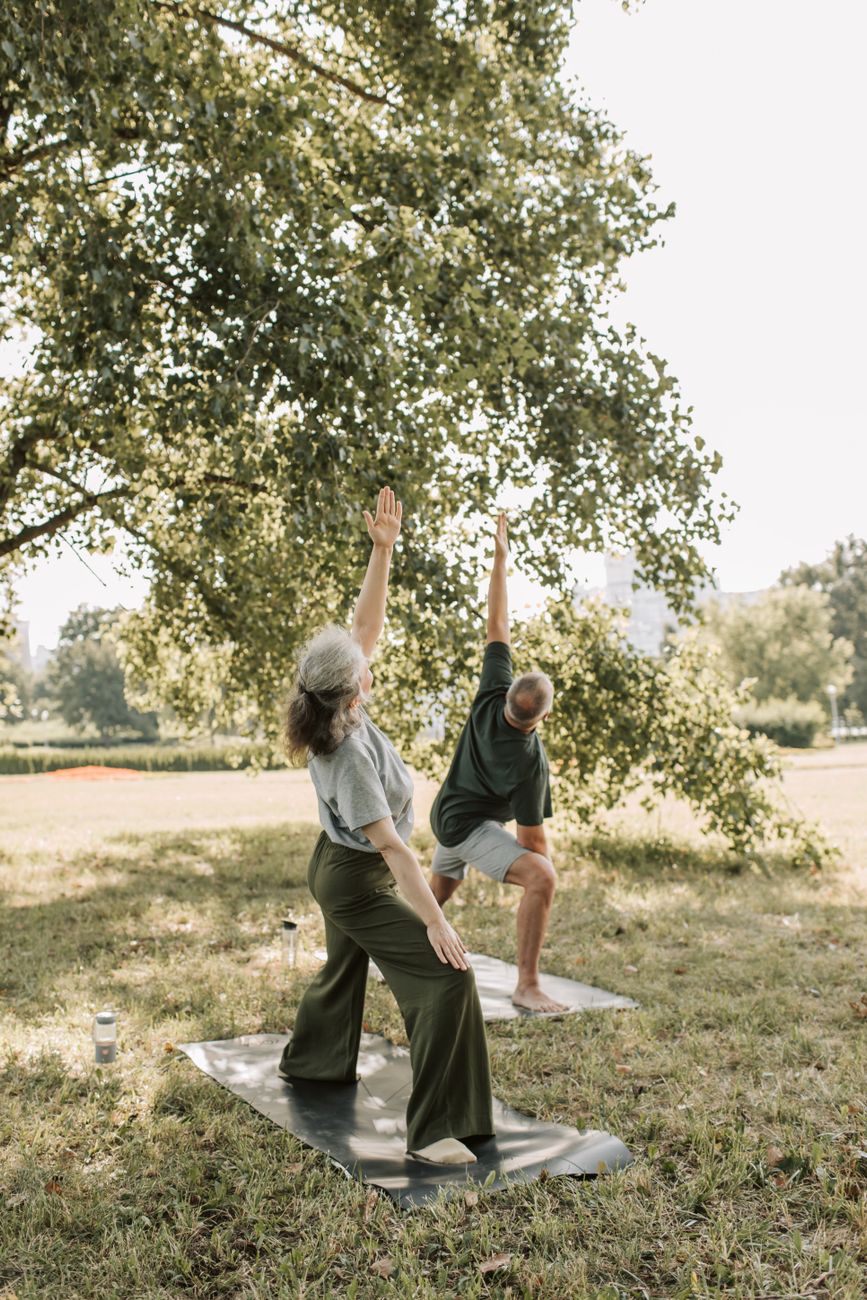 a man and a woman doing yoga
